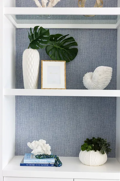 Featuring clean lines and a soft, neutral palette, this vanity area combines function and style. The spacious dual sinks and ample storage ensure practicality in a sophisticated setting.